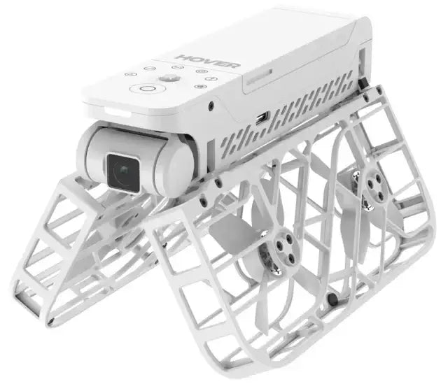 vit drönare med kamera och skyddande galler runt propellrar för stabil flygning