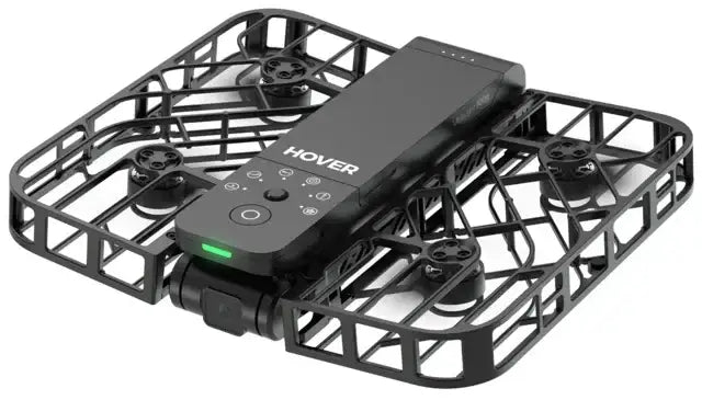 Svart Hoverair X1 Combo drone med skyddande ram och inbyggd kamera på vit bakgrund